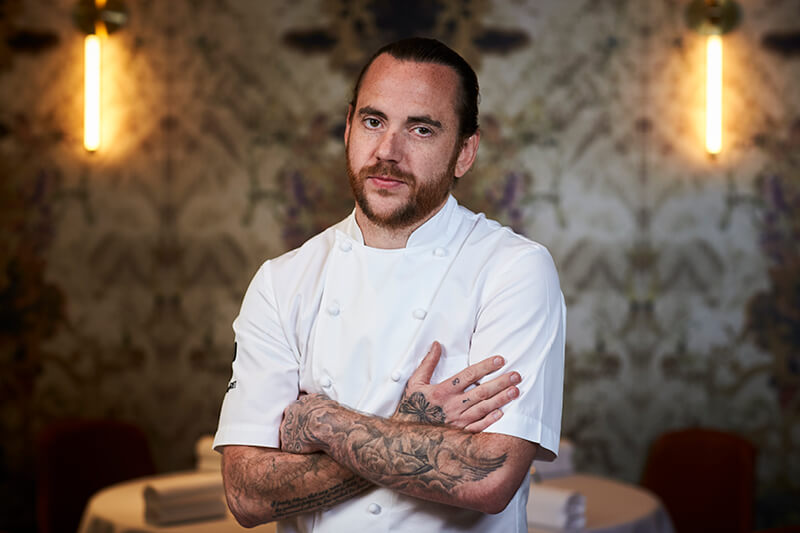 Chef Tom Sellers at Restaurant Story cooking in The Treehouse at Wimbledon